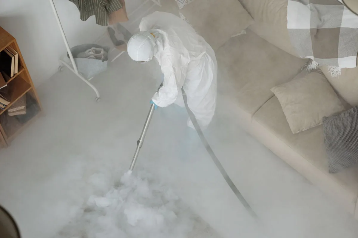 Biohazard cleanup technician in protective equipment, Riviera Beach, FL